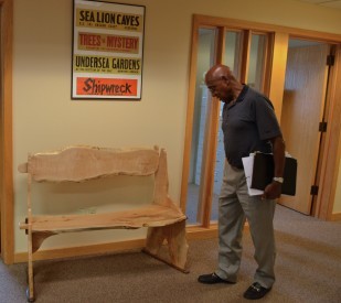 Image of Oregon Travel Information Council and Heritage Tree Committee member Ed Washington looks over the new bench.